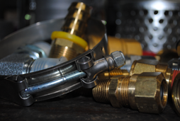 Our selection of products includes the brass and stainless steel fittings and adapters shown as well as the many sizes of clamps shown.
