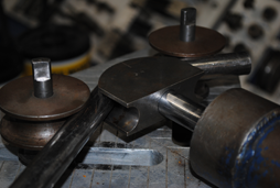 Use new image sent. The one shown is not tubing. Correct alt below. Our on-site ability to bend hydraulic tubing to customer needs is made possible by our hydraulic bending equipment (shown).